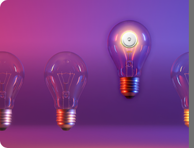 Two unlit lightbulbs and one lit lightbulb floating above the rest