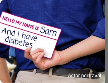 Person holding a sign behind their back that says: Hello my name is Sam and I have diabetes